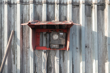 Old phone in a red box on the wall of the mine