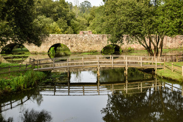 Mirrored bridge in calm waters