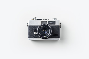 Top view of vintage cameras on white background