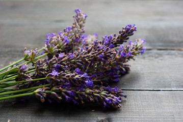 purple lavender flowers on black wooden table background