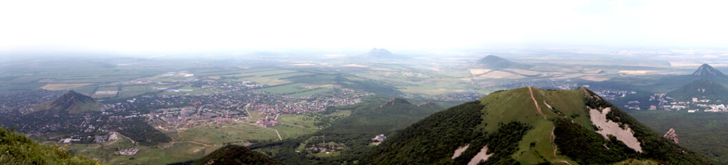 Fototapeta na wymiar Panorama from the top of mount Beshtau, the city of Lermontov, Caucasian Mineral Waters. The city lies at the foot of the mountain - panoramic photo.