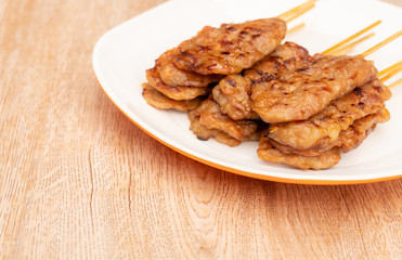 Thai street food, Moo ping (Thai word) grilled pork on white plate