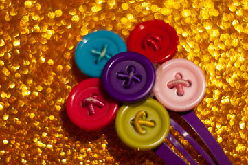 The hair clip from the buttons