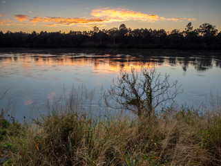 River sunrise with reflections and colourful sky
