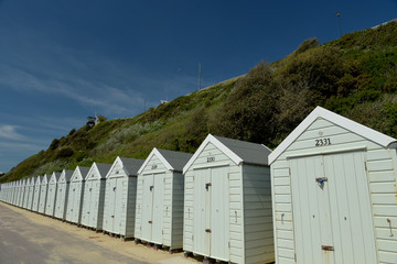 Fototapeta na wymiar Beach huts along the promenade on the seafront at Bournemouth in Dorset