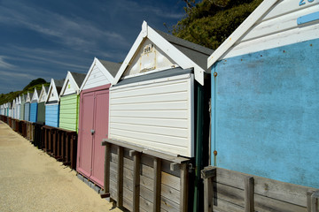Obraz premium Beach huts along the promenade on the seafront at Bournemouth in Dorset
