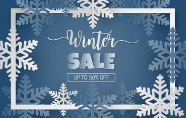 Naklejka na ściany i meble Paper cut style with winter sale banner with blue and white snowflakes on blue background