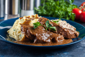 Stewed pork neck with potatoes and sauce