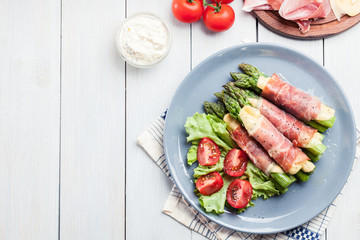 Baked prosciutto and cheese wrapped asparagus