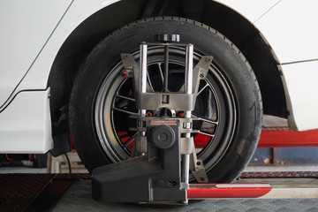 Closeup of tyre's alignment process at workshop