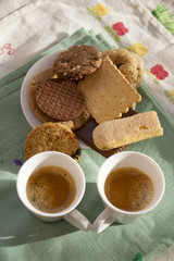 assorted biscuits with two espresso cups