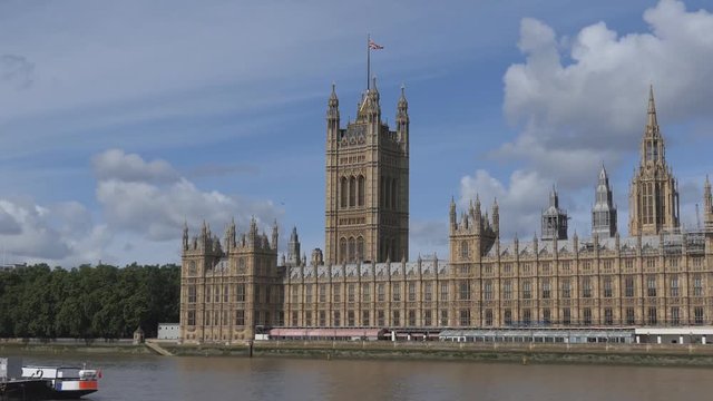 The U.K. flag on the top of Westminster Palace.