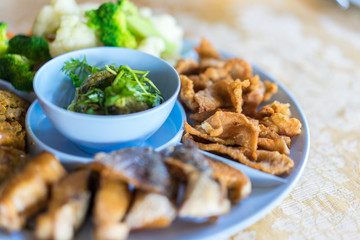 Northern Thai Green Chilli Dip (Nam Prik Num) served with streaky pork with crispy crackling and boiled vegetables.