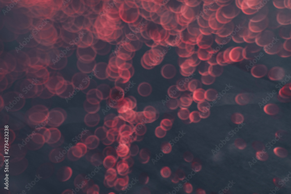 Poster Beautiful red bokeh on a dark abstract background.