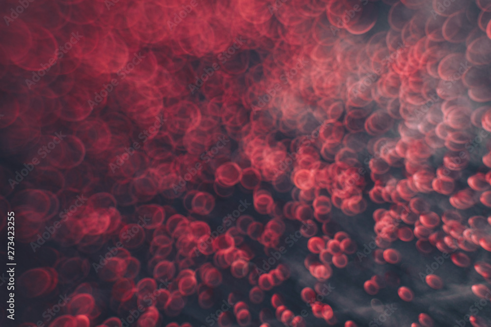 Poster beautiful red bokeh on a dark abstract background.