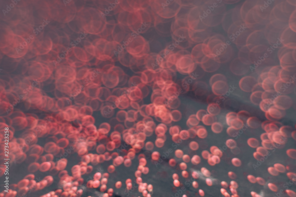 Poster Beautiful red bokeh on a dark abstract background.