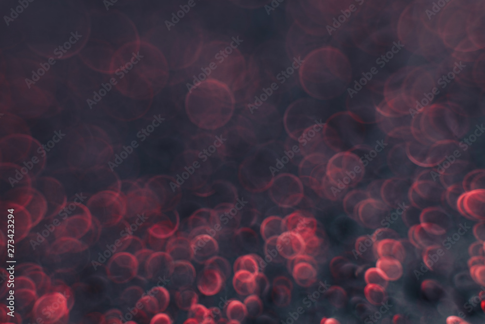 Poster Beautiful red bokeh on a dark abstract background.
