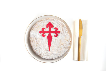 Obraz na płótnie Canvas Tarta de Santiago (St. James cake) famous spanish almond cake typically made in Galicia on white background.