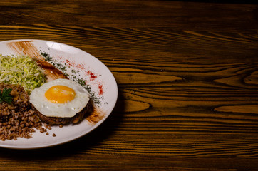 Millet porridge with meat, chopped eggs