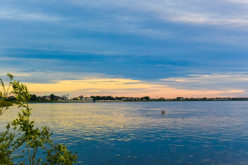 Sunrise sea with burning cloudscape on the coast