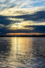 Sunrise sea with burning cloudscape on the coast