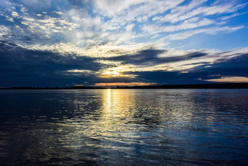 Sunrise sea with burning cloudscape on the coast