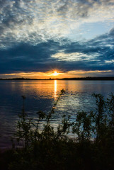 Sunrise sea with burning cloudscape on the coast