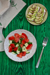 A healthy lunch: a salad and avocado sandwiches.