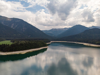 Germany, August 2018: Amazing turquoise lake Sylvenstein, upper Bavaria. Aerial view.