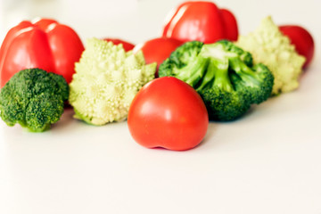 Vegetable variety on wooden white table. Selection of summer and autumn vegetables, space for text.