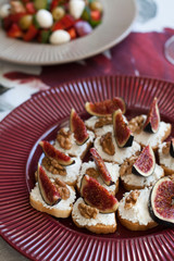 A fancy dinner: salad, and white bread sandwiches.
