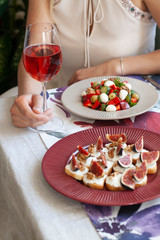 A fancy dinner: salad, and white bread sandwiches.