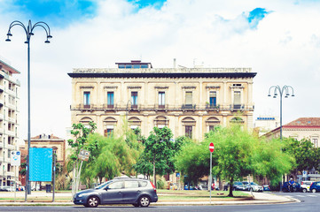 Traditional architecture of Sicily in Italy, typical street of Catania, facade of old buildings .