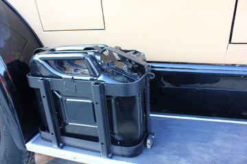 black canister for gasoline on an old car