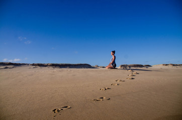 yoga girl on the beach