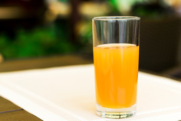 glass of fresh juice on a table in a cafe