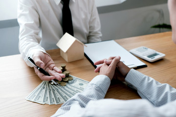 Business people signing contract making a deal with real estate agent Concept for consultant and home insurance concept.