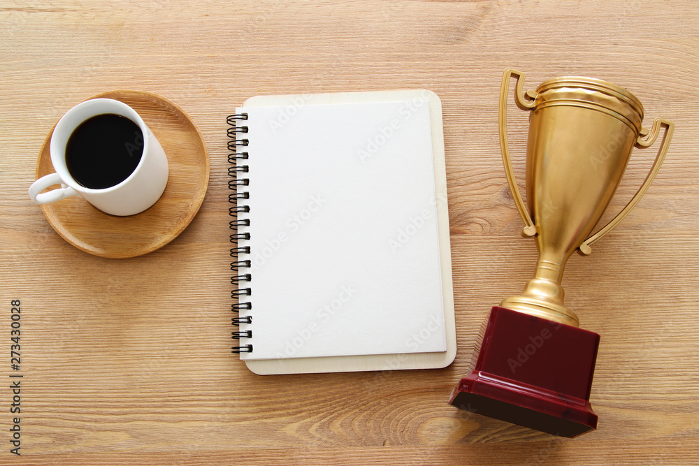 Poster open notebook with empty pages over wooden old office desk table. top view, flat lay