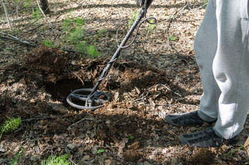 Man with Metal detector looking for a treasure