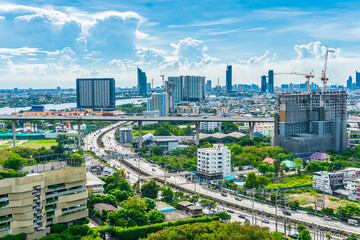Naklejka na ściany i meble Bangkok City skyline with urban skyscrapers with cloud sky background, Thailand