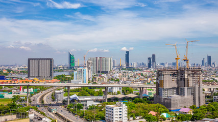 Fototapeta premium Bangkok City skyline with urban skyscrapers with cloud sky background, Thailand