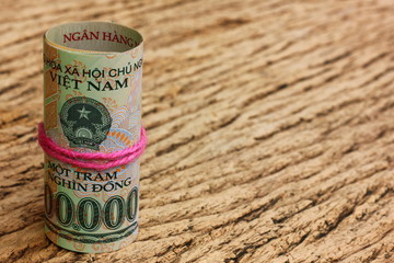 Dong bank note on vintage brown wood backgroud. Vietnam money circulated world wild. money for payment,seaving, legal repayment.