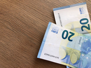 twenty euro banknote on a light background
