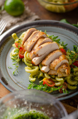 Homemade pesto pasta with grilled chicken