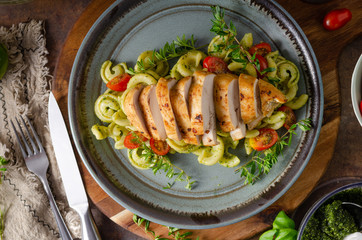 Homemade pesto pasta with grilled chicken