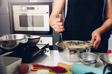Woman beat dough mixer