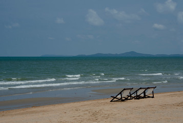 Fototapeta na wymiar empty chair on sea beach with no people