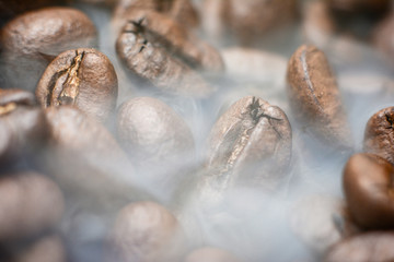 Roasting the coffee beans of Arabica. Coffee and smoke.
