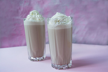 Milkshake with chocolate on a light background.
