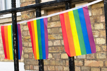 Rainbow LGBT pride flag decoration on a building in the street